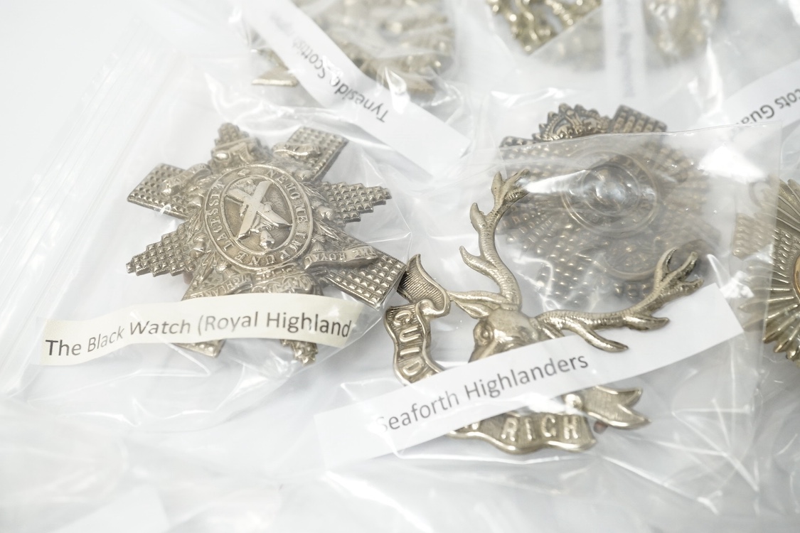 Eighteen Scottish and the Borders cap badges and Glengarry badges, including; Royal Scot Fusiliers, 96th Regiment of Foot, the Black Watch, Cameron Highlanders, Argyle and Sutherland Highlanders, Highland Light Infantry